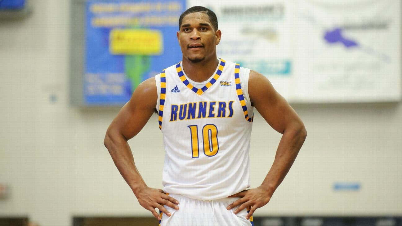 Kevin Mays with hands on hip in Cal State Bakersfield uniform.