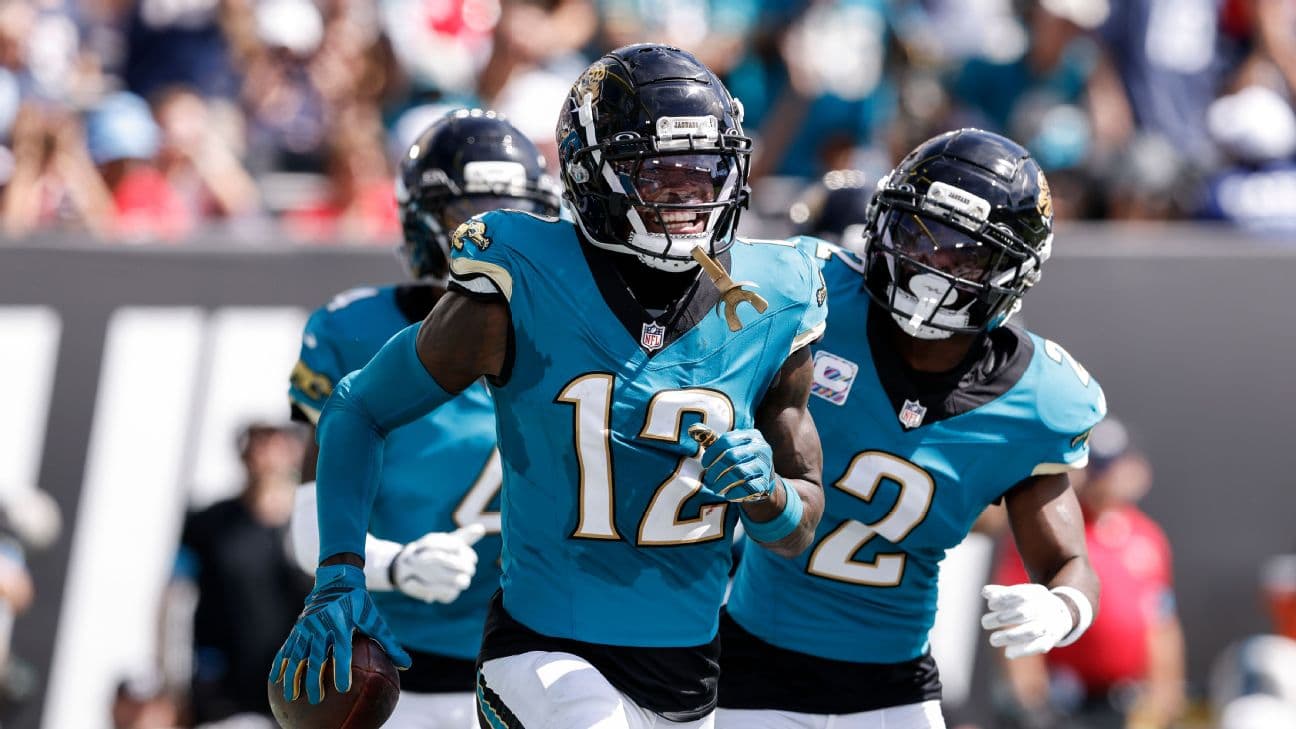 Cornerback Travis Hunter #12 of the Jacksonville Jaguars celebrates with teammates after making his first NFL interception during the first half of the game against the New England Patriots at EverBank Stadium on September 27, 2026 in Jacksonville, Florid