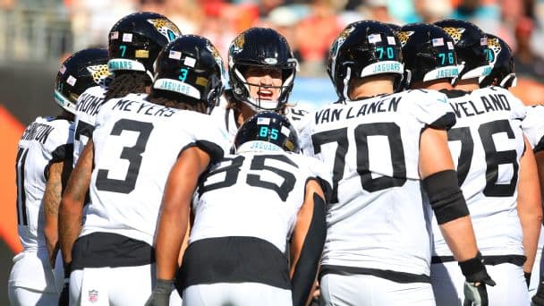 Trevor Lawrence in the huddle with the Jaguars offense.