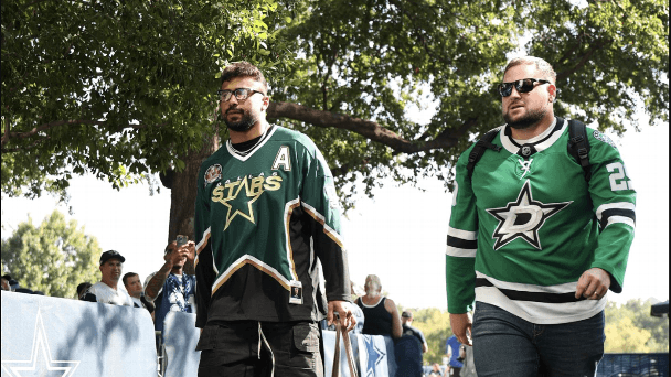 Cooper Beebe and Brevyn Spann-Ford wearing green Dallas Stars jerseys of Jake Oettinger and Mike Modano