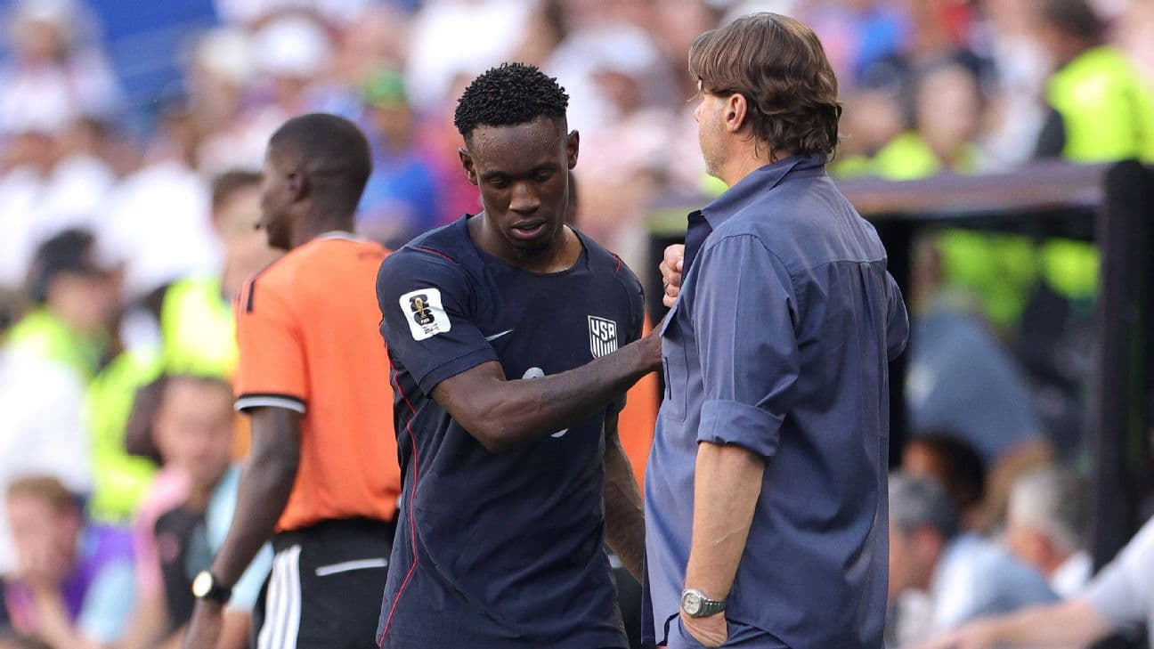 Folarin Balogun #20 of the United States shakes hands with Mauricio Pochettino, Head Coach of the United States, after being substituted during the FIFA World Cup 2026 Round of 16 match between USA and Belgium at Seattle Stadium on July 06, 2026 in Seatt