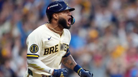 Jackson Chourio #11 of the Milwaukee Brewers celebrates his game-winning two-run single against the San Diego Padres during the ninth inning.