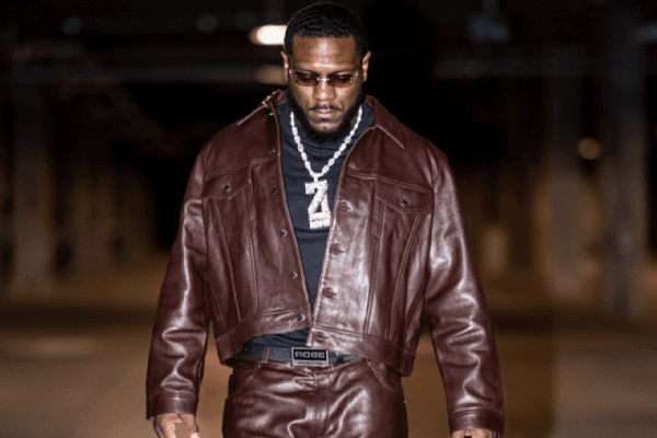 Zaire Franklin leaned into fall style with a burgundy leather jacket and matching pants over a black shirt. Tinted shades, tan patterned shoes and an oversized “Z” pendant